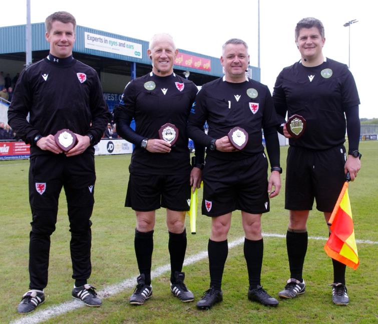 Post match officials with trophies